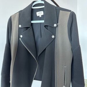 Wilfred motorcycle jacket in black and green.